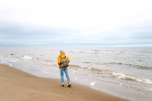 Happy tourist  enjoying sea landscape.  Lifestyle, travel, tourism, nature, active life, adventure.