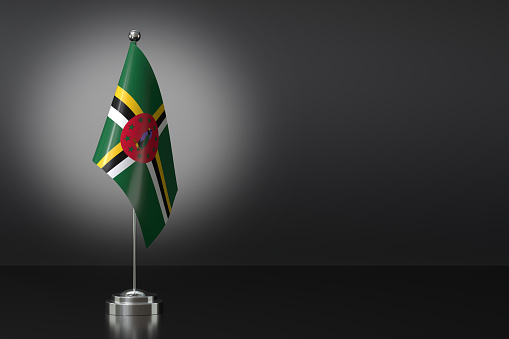 Small National Flag of the Commonwealth of Dominica on a Black Background. 3d Rendering