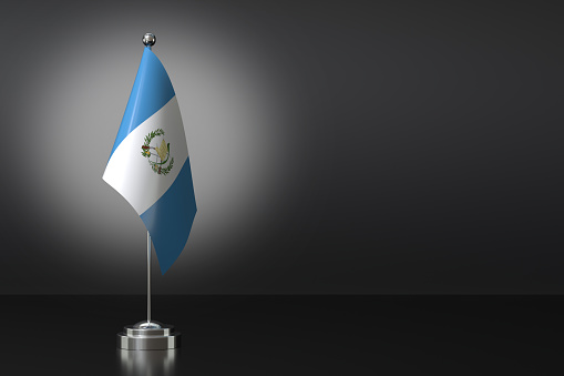 Small National Flag of the Republic of Guatemala on a Black Background. 3d Rendering