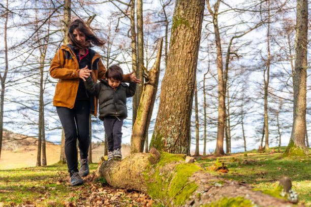 istock Mother with her son walking in a tree in a forest very happy on Mount Erlaitz in Irun, Basque Country 1977183419