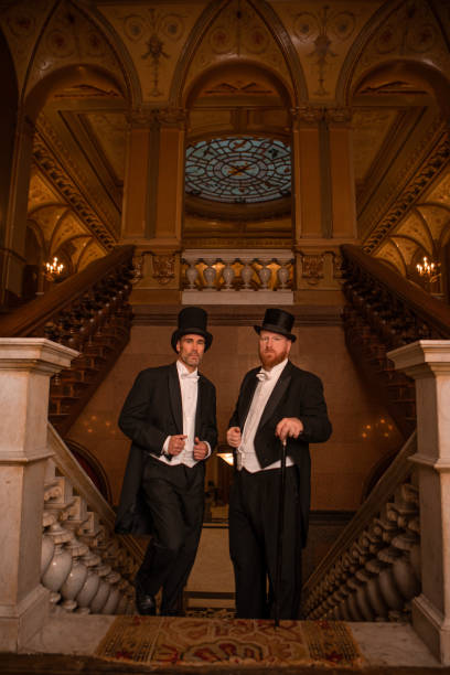 istock Two handsome elegant 1920s style gentlemen in a luxury stately home 1977185041