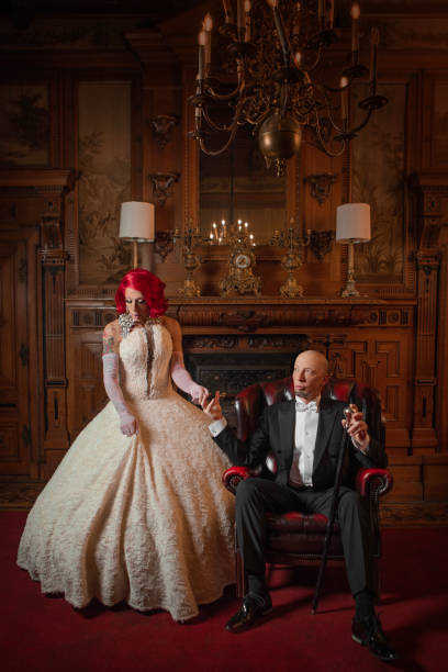 istock A beautiful elegant 1920s style redhead drag queen with a chaperone 1977186085