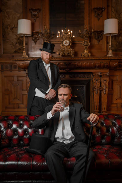 istock Two handsome elegant 1920s style gentlemen in a luxury stately home 1977189867