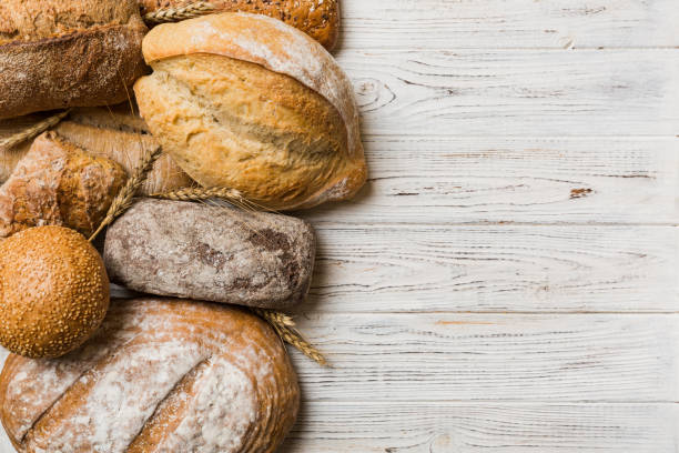 istock Homemade natural breads. Different kinds of fresh bread as background, top view with copy space 1977193124