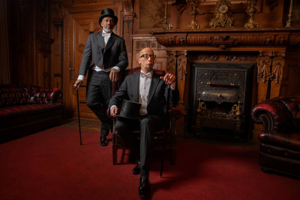 Two handsome 1920s style gentlemen in a drawing room