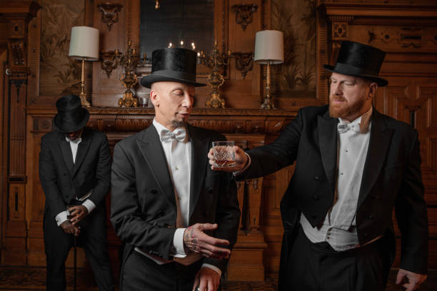 istock Three handsome 1920s style gentlemen in a drawing room 1977197525