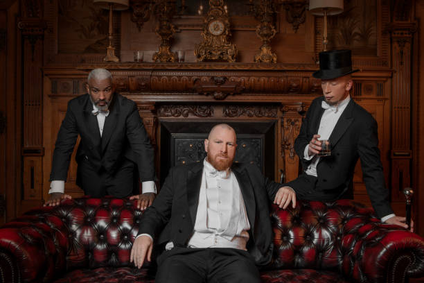 istock Three handsome 1920s style gentlemen in a drawing room 1977198593