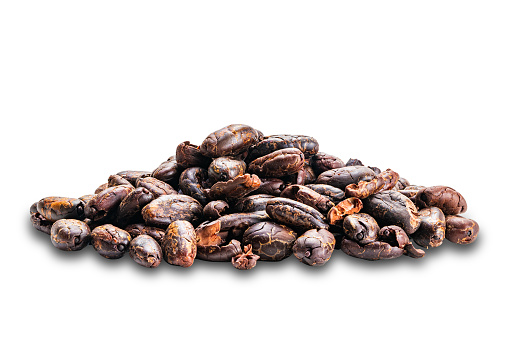 Pile of dry roasted cacao nibs isolated on white background with clipping path.
