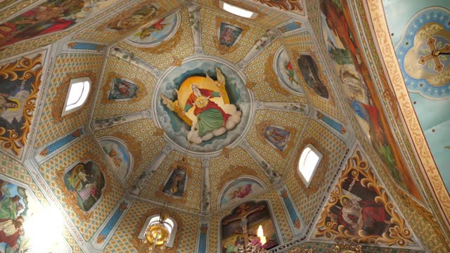 Painting of the dome in the middle of the church. Interior of the temple