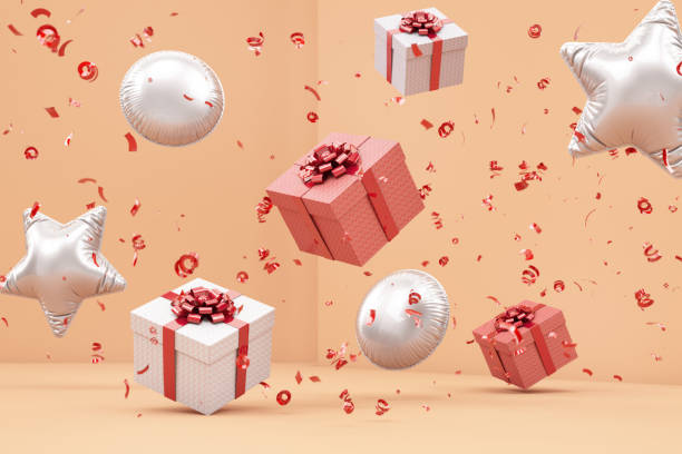 istock Gift Boxes with Red Ribbon Bow Levitating on Beige Background 1977212959