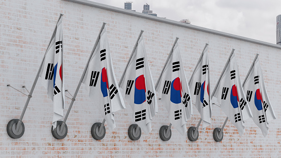 South Korean Flags in a Row on the White Brick Wall. 3D Render