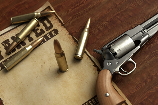 Old Revolver with Bullets and Wanted Paper. 3D Render