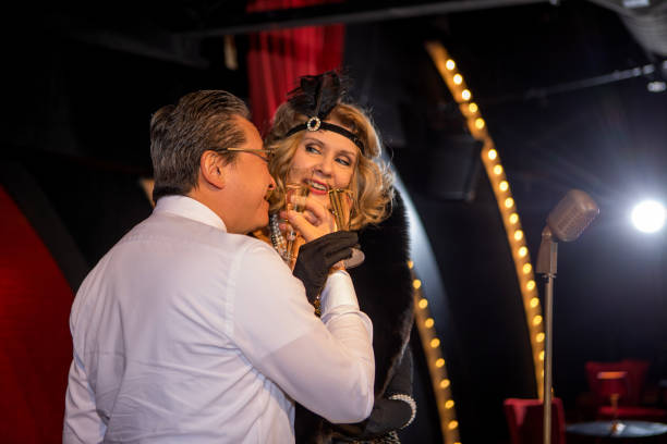 istock Beautiful couple of performers singing on stage 1977232508
