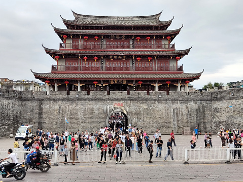 Tourists sightseeing at old Guangji Gate in Chaozhou, a city in the eastern Guangdong province of China. Chaozhou is a cultural center of the Chaoshan region.