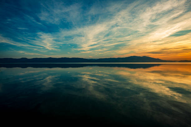 istock Sunset over calm lake view 1977252750