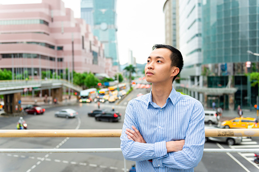 Horizontal color portrait image of a young Taiwanese city professional in Taipei.