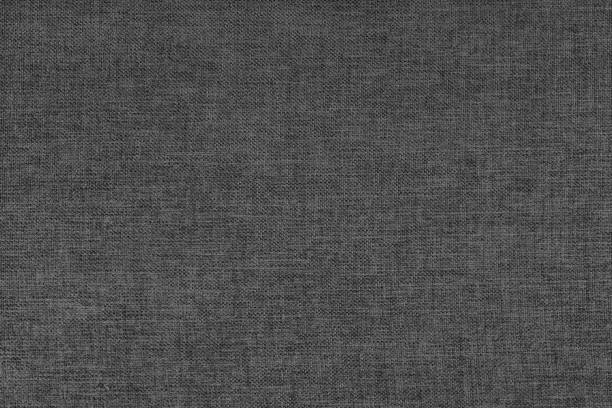 istock Textile background, black coarse fabric texture, cloth structure, jacquard woven upholstery 1977265756