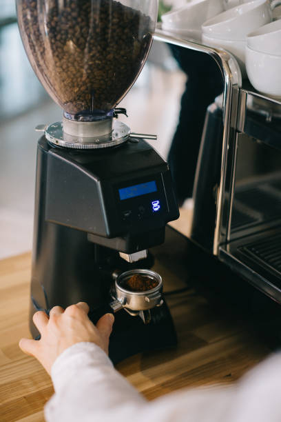 istock The process of making coffee. A coffee grinder makes a batch of coffee. 1977279316