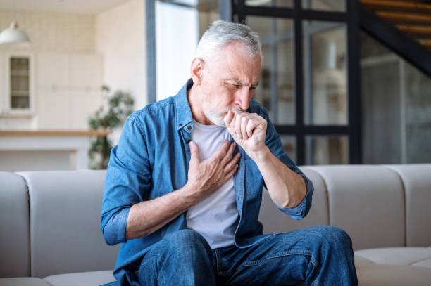 istock Man having asthma attack, difficulties with breathe, feeling severe pain 1977287831
