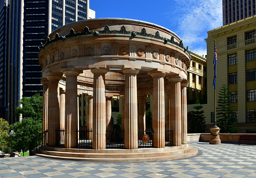 Brisbane, Queensland, Australia: Anzac war memorial, Anzac square - Shrine of Remembrance, home to the eternal flame - architects Buchanan and Cowper - an 18 columns rotunda, in Greek Classic Revival style, built using built of Helidon sandstone, completed in1930 - dedicated to the Australian and New Zealand Army Corps in World War I, ANZAC - names of battles cover the internal frieze.