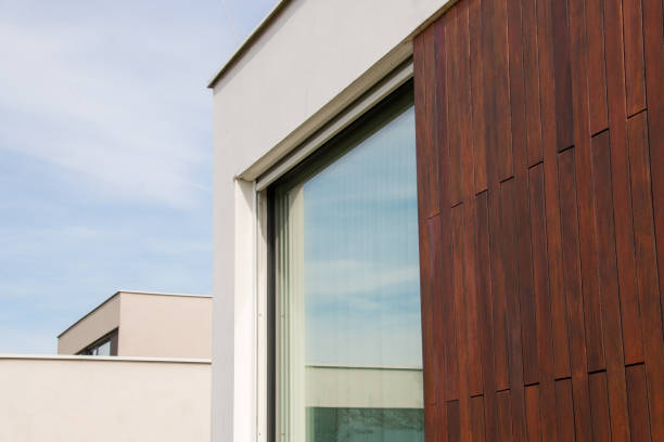 istock House facade with glass window and wood cladding modern architecture idea 1977293710
