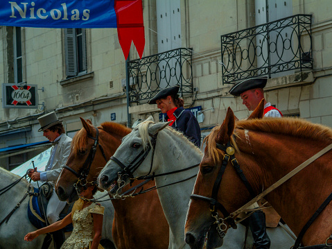 02/01/2024 Saumur Maine et Loire Loire Valley France. Town is famous for its\nequestrian school, Cadre Noir. This is a parade of horses and horse riders through the town. The streets are crowded with tourists and onlookers who are appreciating the horses and riders.