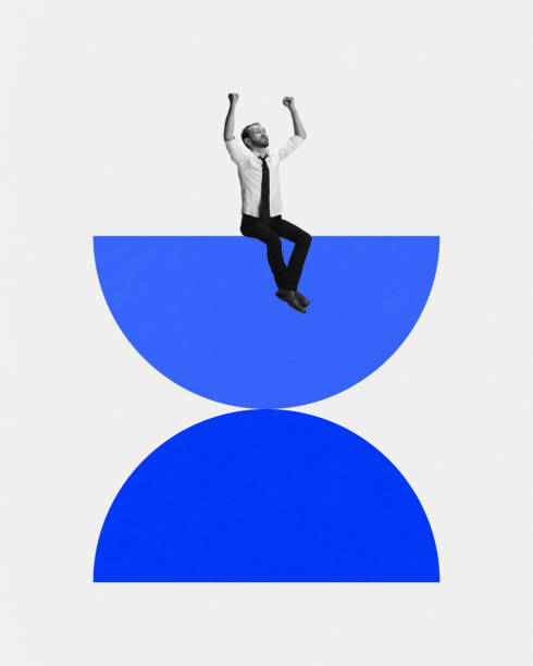 istock Modern aesthetic artwork. Young man sitting, balanced on two semi spheres looks as hourglass and raising hands of joy. Deadlines. 1977315217