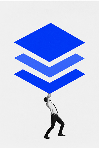 Modern aesthetic artwork. Man holding up series of oversized blue rhombuses, depicting support and structure. Concept of multimedia, digital reality, integration process, technology future. Ad