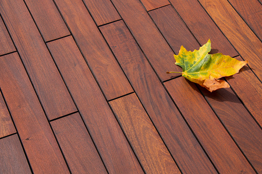 Ipe wood texture planks with autumn season symbol