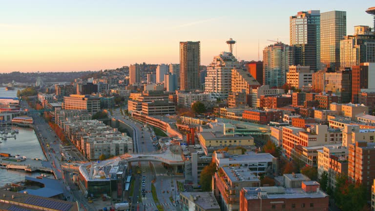 AERIAL Waterfront of Belltown, Seattle at sunset