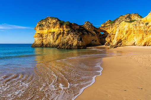 View on the shore of the Atlantic Ocean near the small town of Alvor in Algarve, Portugal.