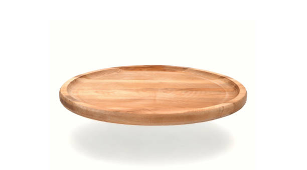 istock Empty round wooden plate with sides hanging on a white background with shadow. Space for branding, text or menu. Business food brand template. Layout. Cooking food. Culinary background. 1977376112