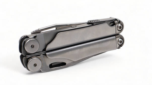 istock Folded steel multitool isolated on white background. A tool for daily practice. All in one. Construction and repair. Compact and portable product. Pocket knife. EDC concept. 1977377733