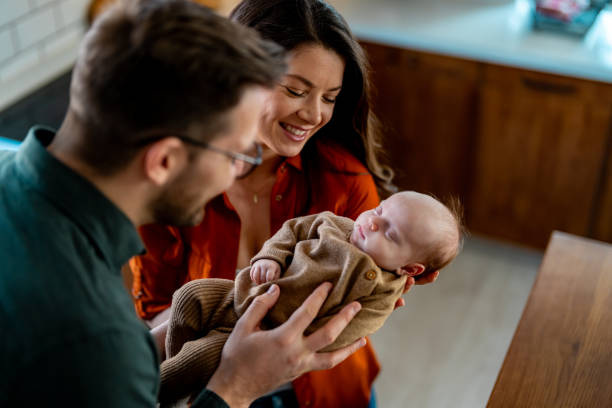 istock Parents bonding with their baby boy during weekend morning 1977381562