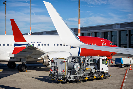 Airplane Boeing 737-max, few minutes before the departure, is parked in the Berlin Brandenburg, Germany