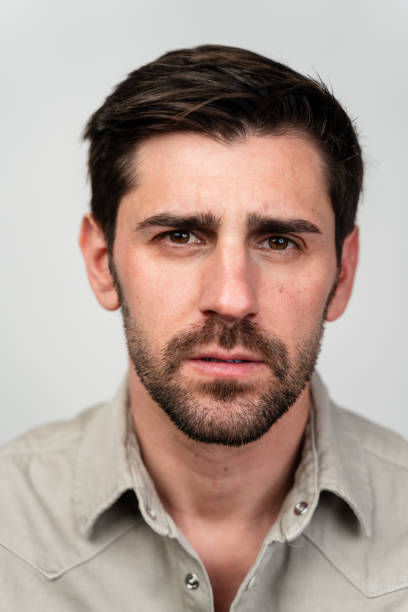 istock Pensive Man in Khaki Shirt 1977397139
