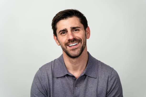 istock A man with a goatee smiles directly at the camera, displaying warmth and friendliness. 1977399269
