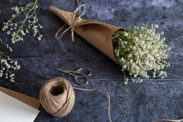 istock Medium height woman working with dried flowers assemble composition, decor and floristry concept 1977399826