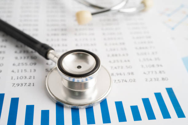 istock Stethoscope on graph paper, Finance, Account, Statistics, Investment, Analytic research data economy and Business company concept. 1977405206
