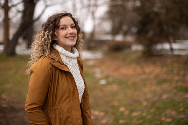 istock Young woman on a walk at public park 1977413808