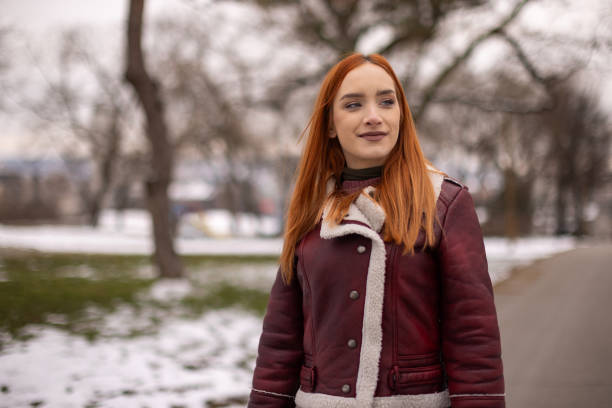 Woman enjoying a walk at public park on winter day