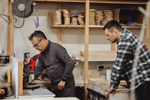 istock Woodworkers discussing project in woodshop. 1977420242