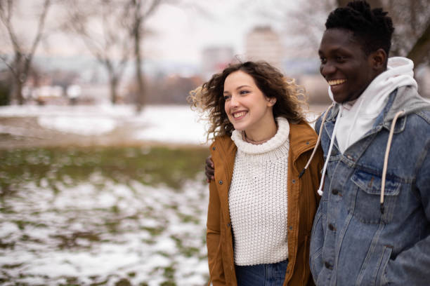 istock Young couple having fun time on a walk at public park 1977422856