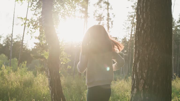 Female runner enjoys jogging in nature