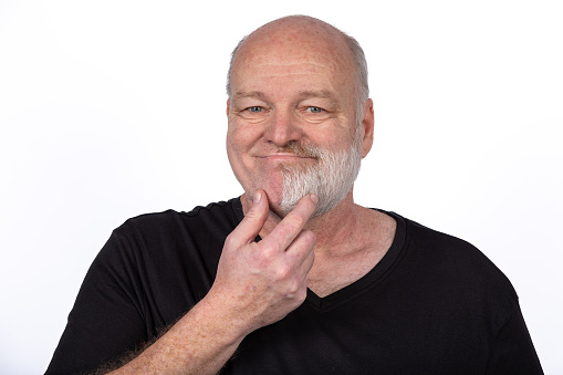 Smiling Middle-Age Man with Unique Half-Beard in Black T-Shirt on White Background, Expressing Confidence and Joy