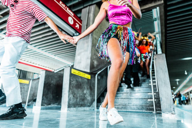 Couple celebrating carnival in the subway station