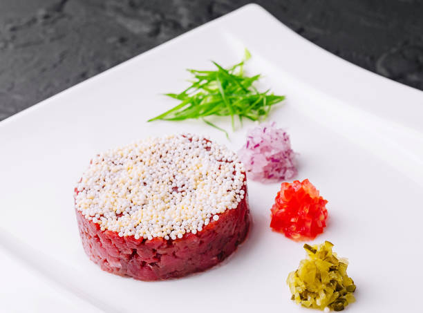 Chopped beef, steak tartare served and pickles
