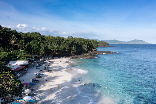 Landscape of the white sand beach of Bias Tugel situated near Padangbai harbour in Bali Indonesia.