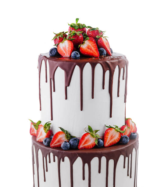 istock White cake with melted dark chocolate with fresh berries 1977480447
