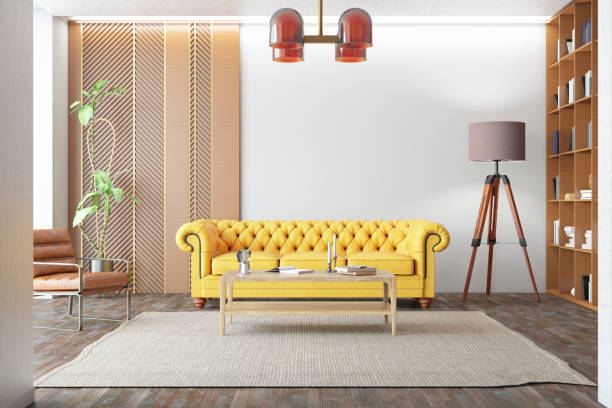 istock Modern Bright Living Room with a Yellow Chesterfield Sofa and Library 1977498846